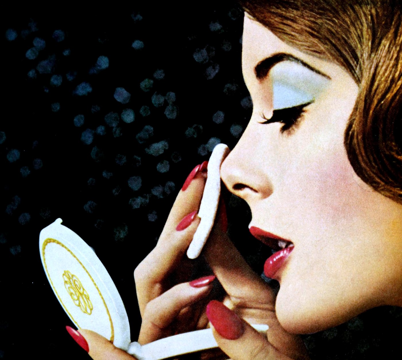 1960s woman putting on face powder