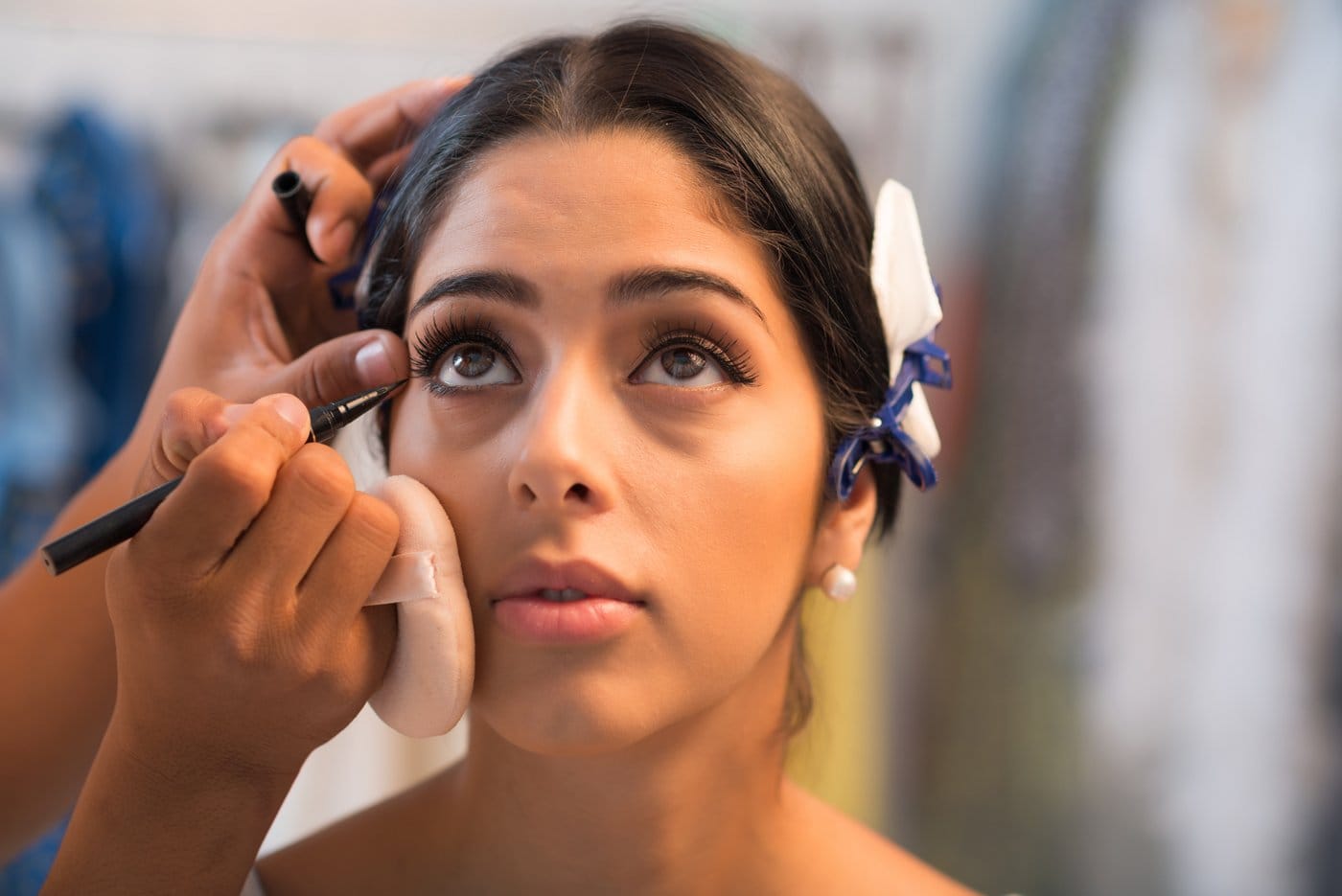 Applying eyeliner makeup to the lower lash line - waterline