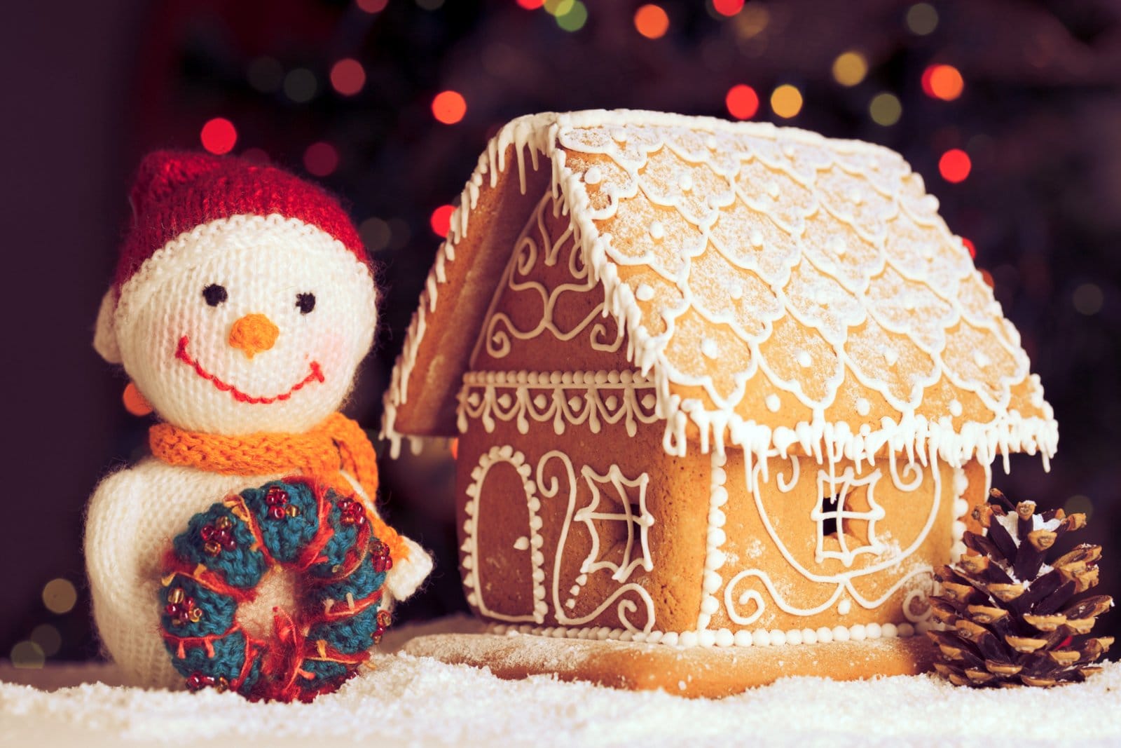 Beautiful gingerbread house with a toy snowman