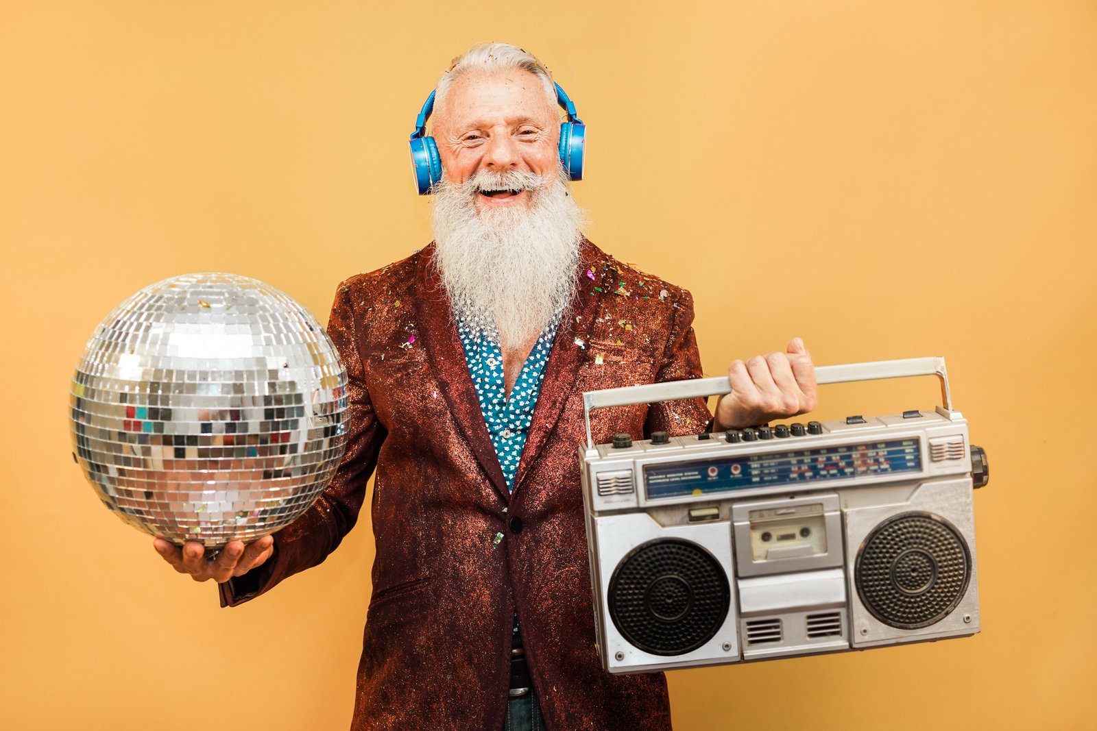 Boomer hipster with headphones, disco ball and boom box