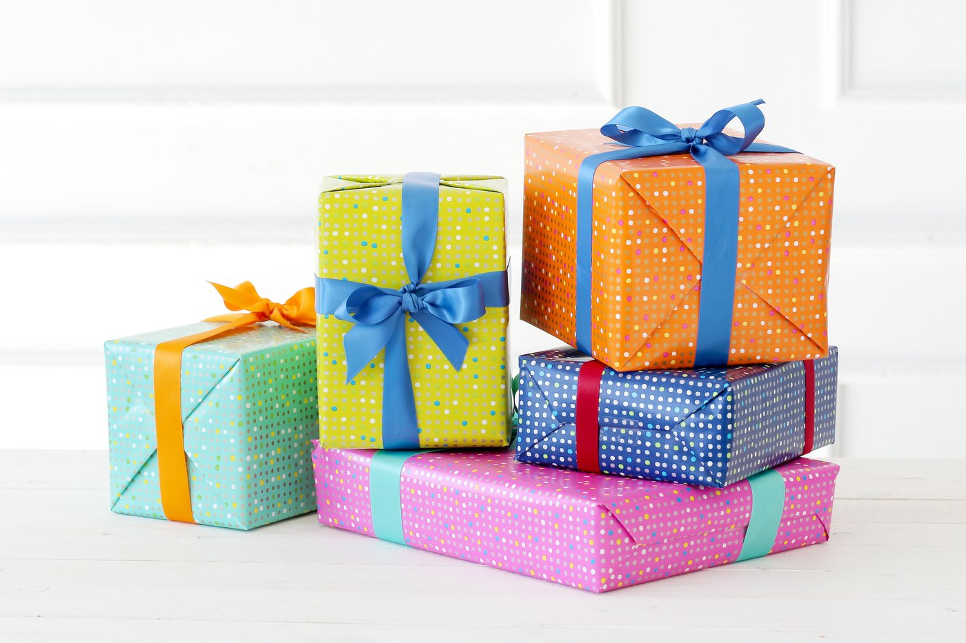 Colorful wrapped gifts with bows
