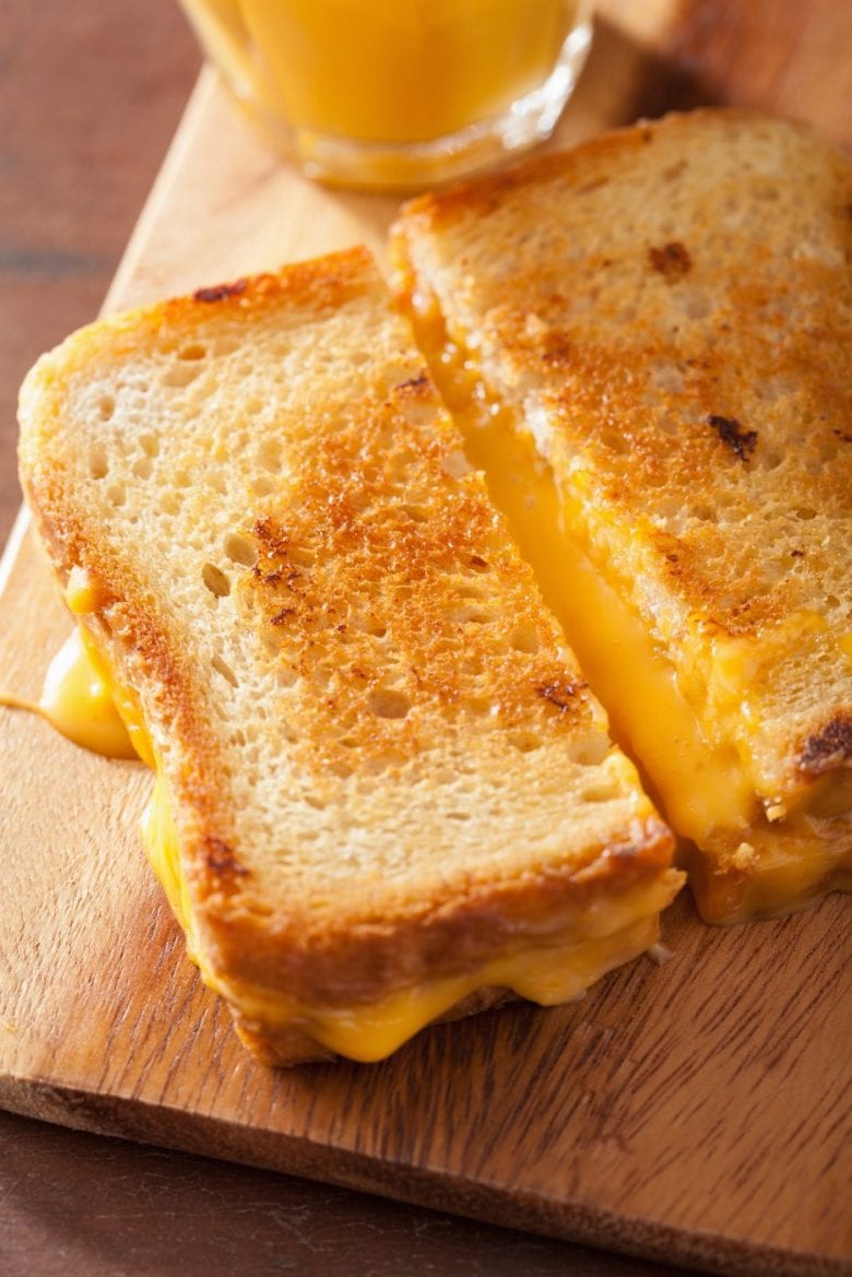 Delicious gooey grilled cheese sandwich with melted American cheese
