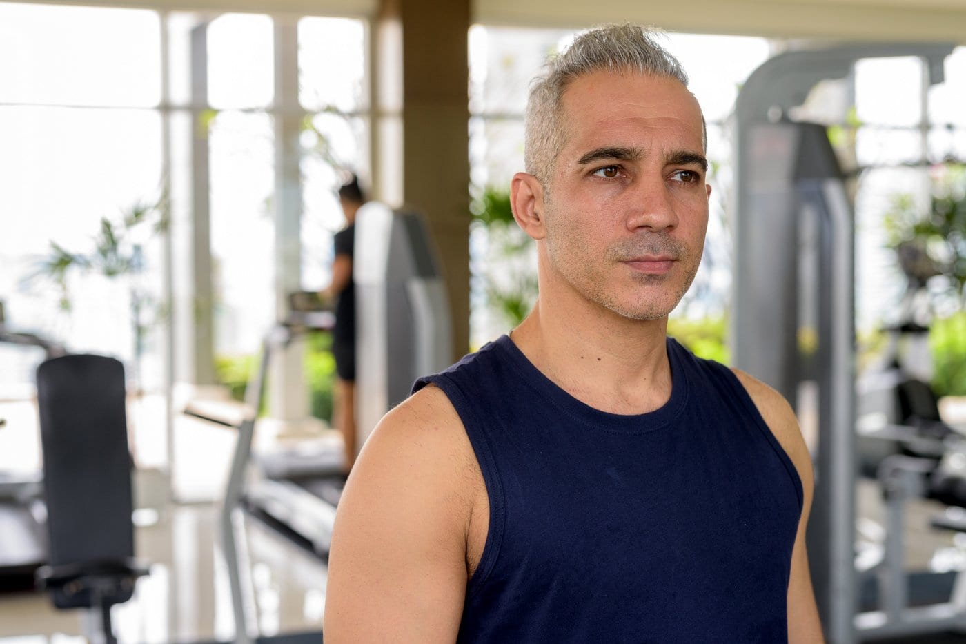 Fit man with gray hair working out