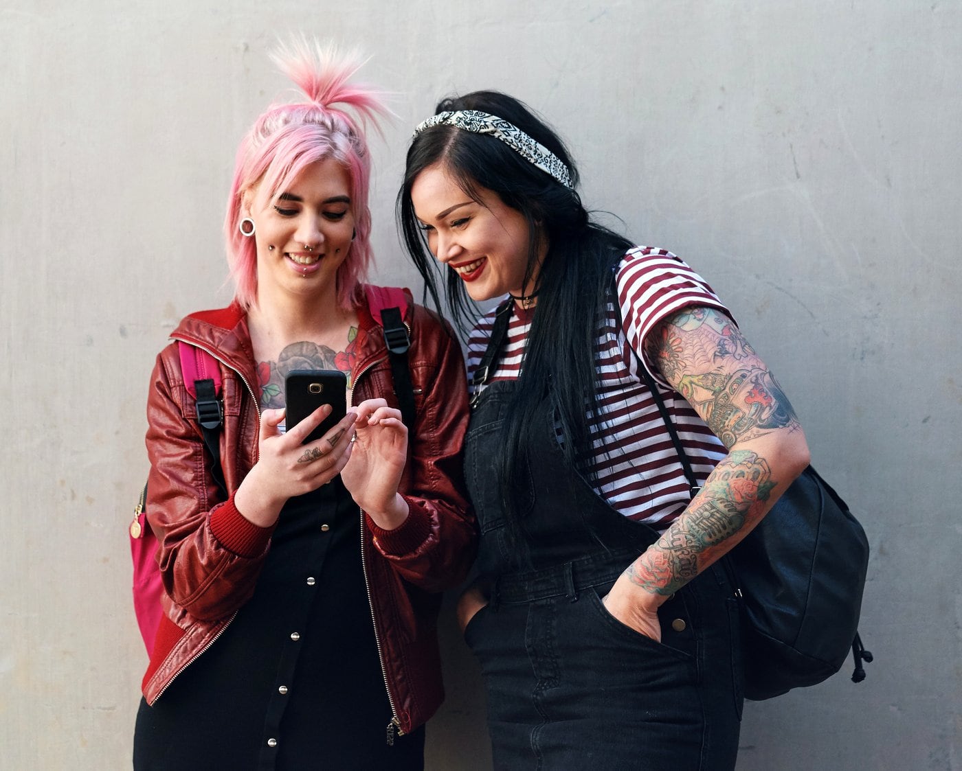 Gen Z women-girls looking at a smartphone