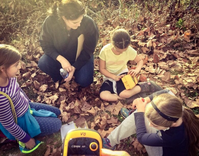 Girl scouts hunting for geocaches