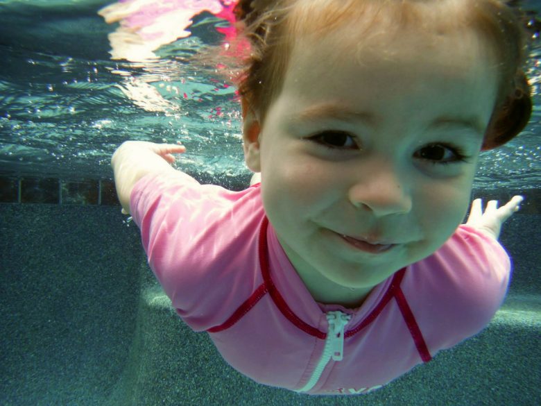 ISR infant self-rescue swimming lessons - Girl in pink