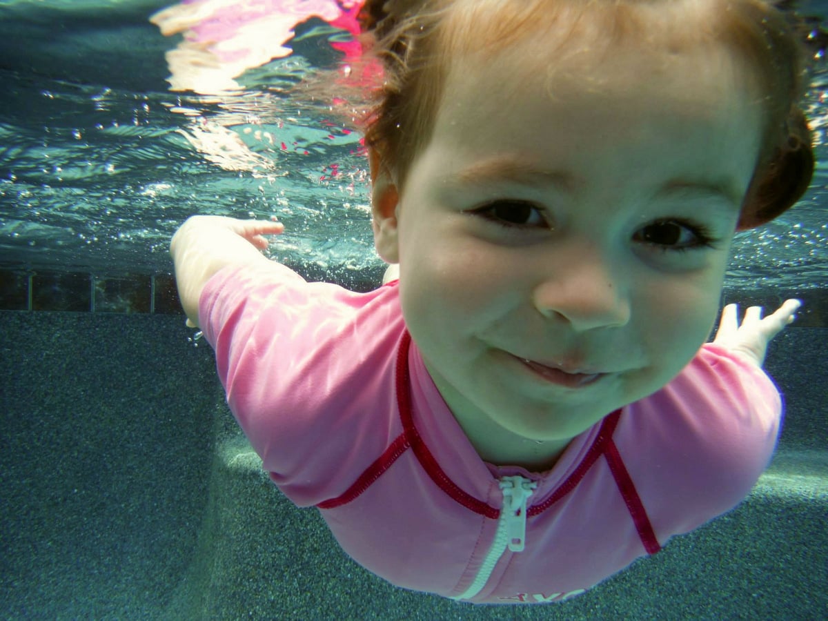 ISR infant self-rescue swimming lessons - Girl in pink