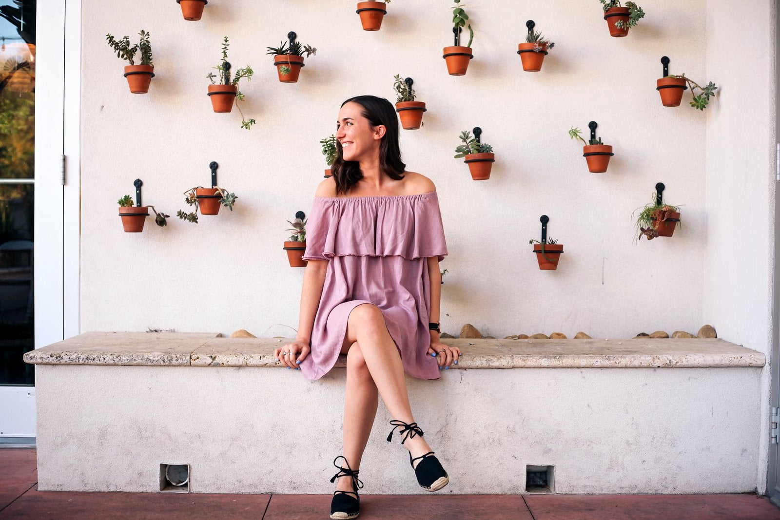 Indoor plants decorating: Matching terra cotta plant pots hanging on a wall