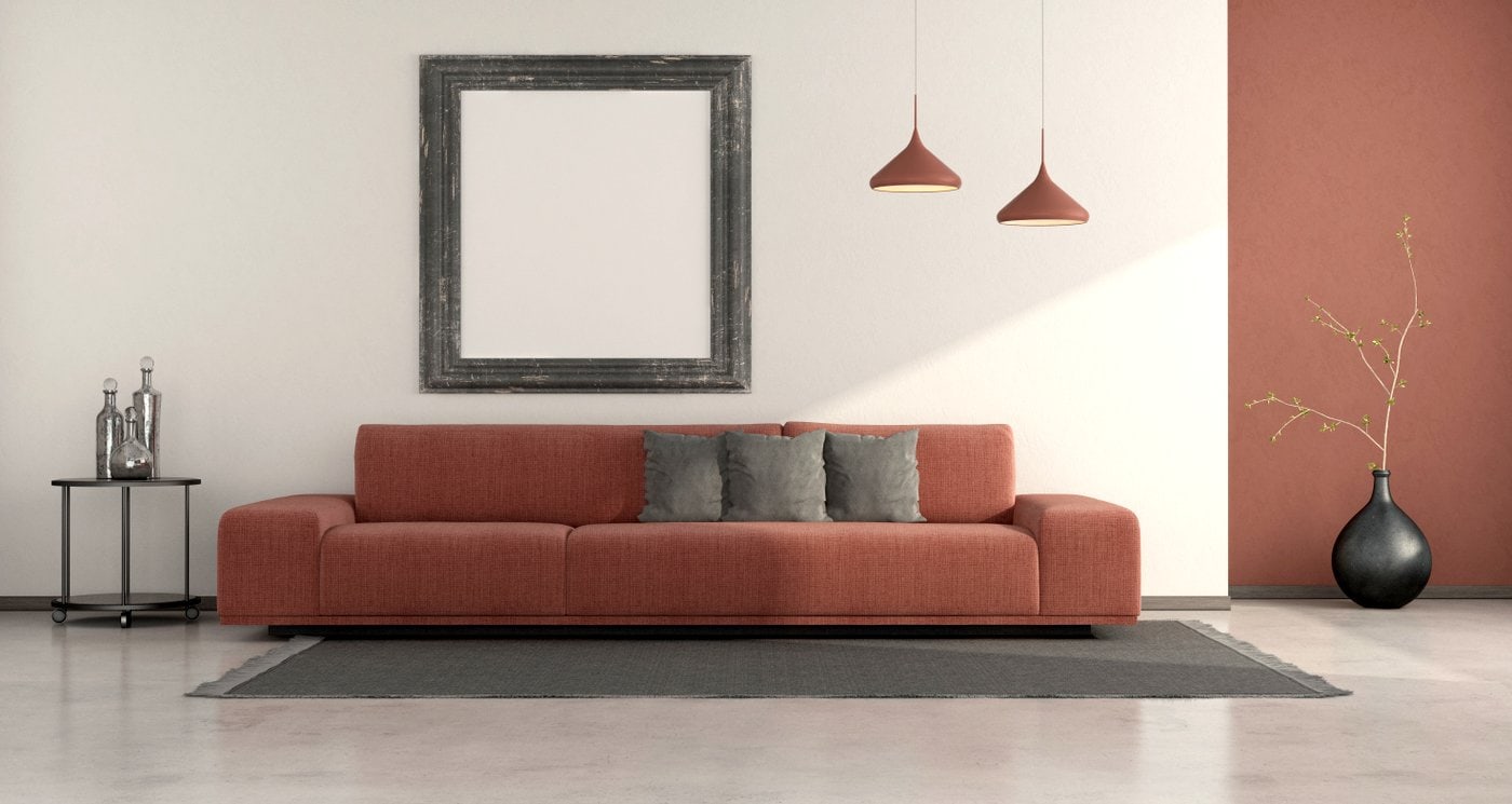 Minimalist living room with brick red sofa