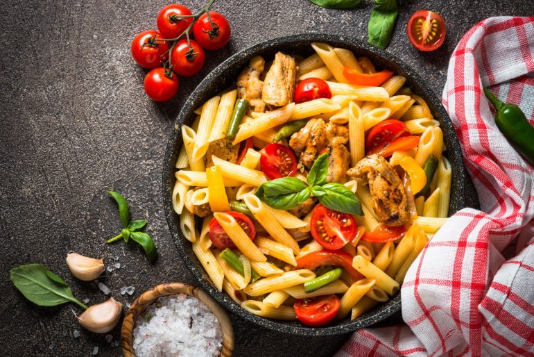 Penne pasta with chicken and tomatoes - Italian cooking
