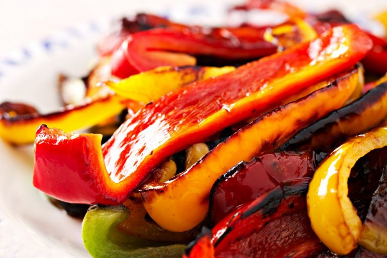 Roasted yellow green and red bell peppers