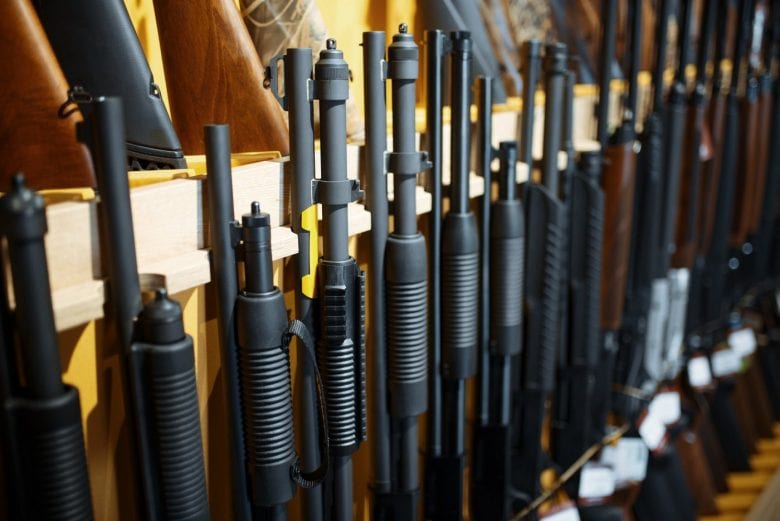 Row of rifles in a gun shop