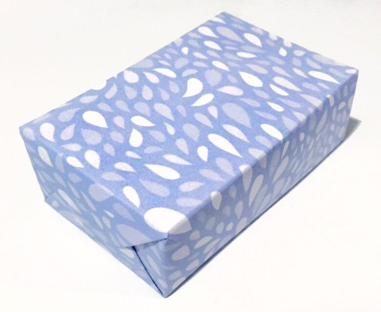 Small box covered with blue free downloadable wrapping paper