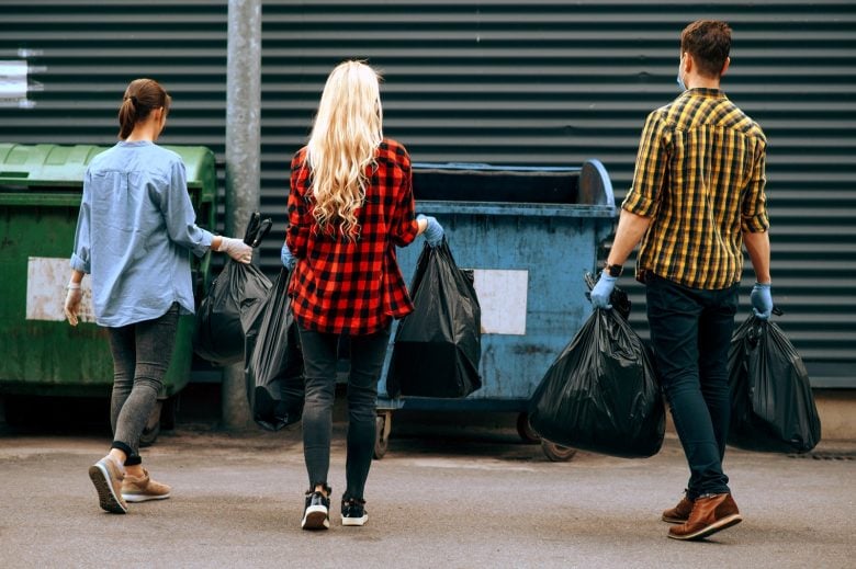 Teenage volunteers picking up trash in the community
