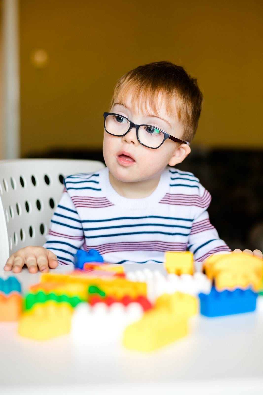 Toddler boy playing with blocks
