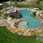 A natural pool that's the centerpiece of the backyard